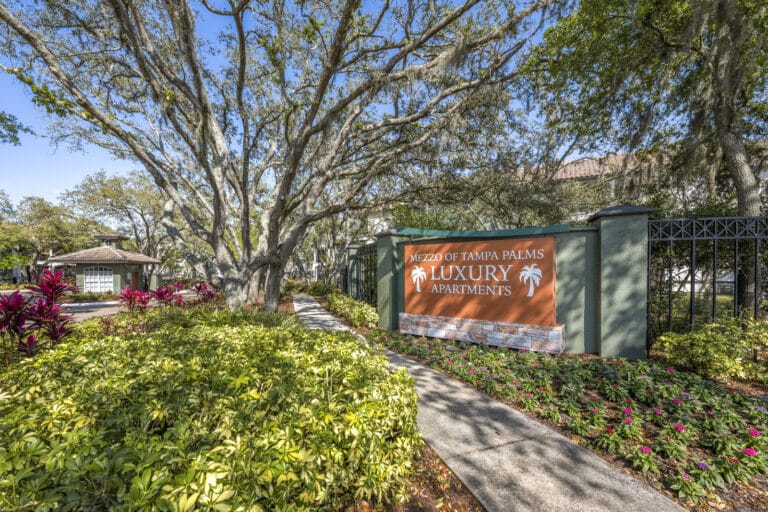 Mezzo of Tampa Palms Apartments entrance sign.